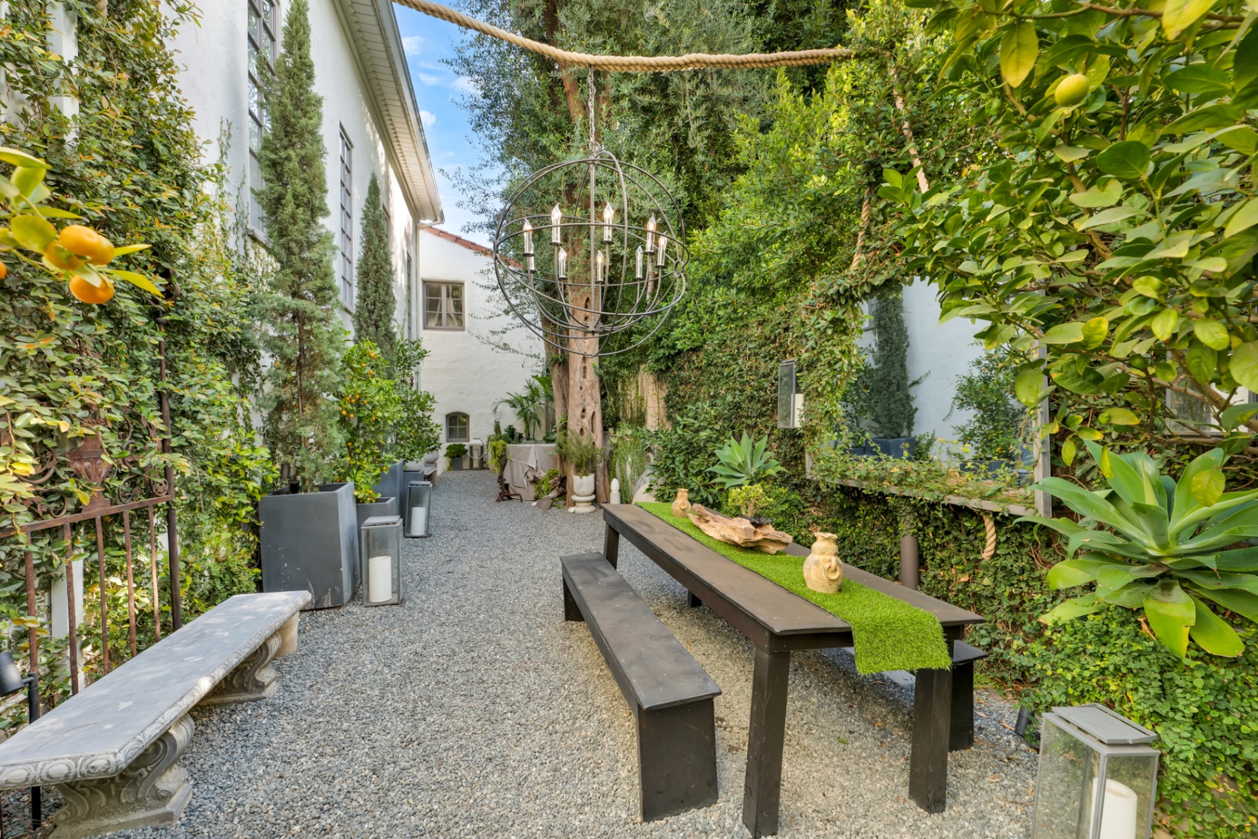 Garden dining under woven pendants