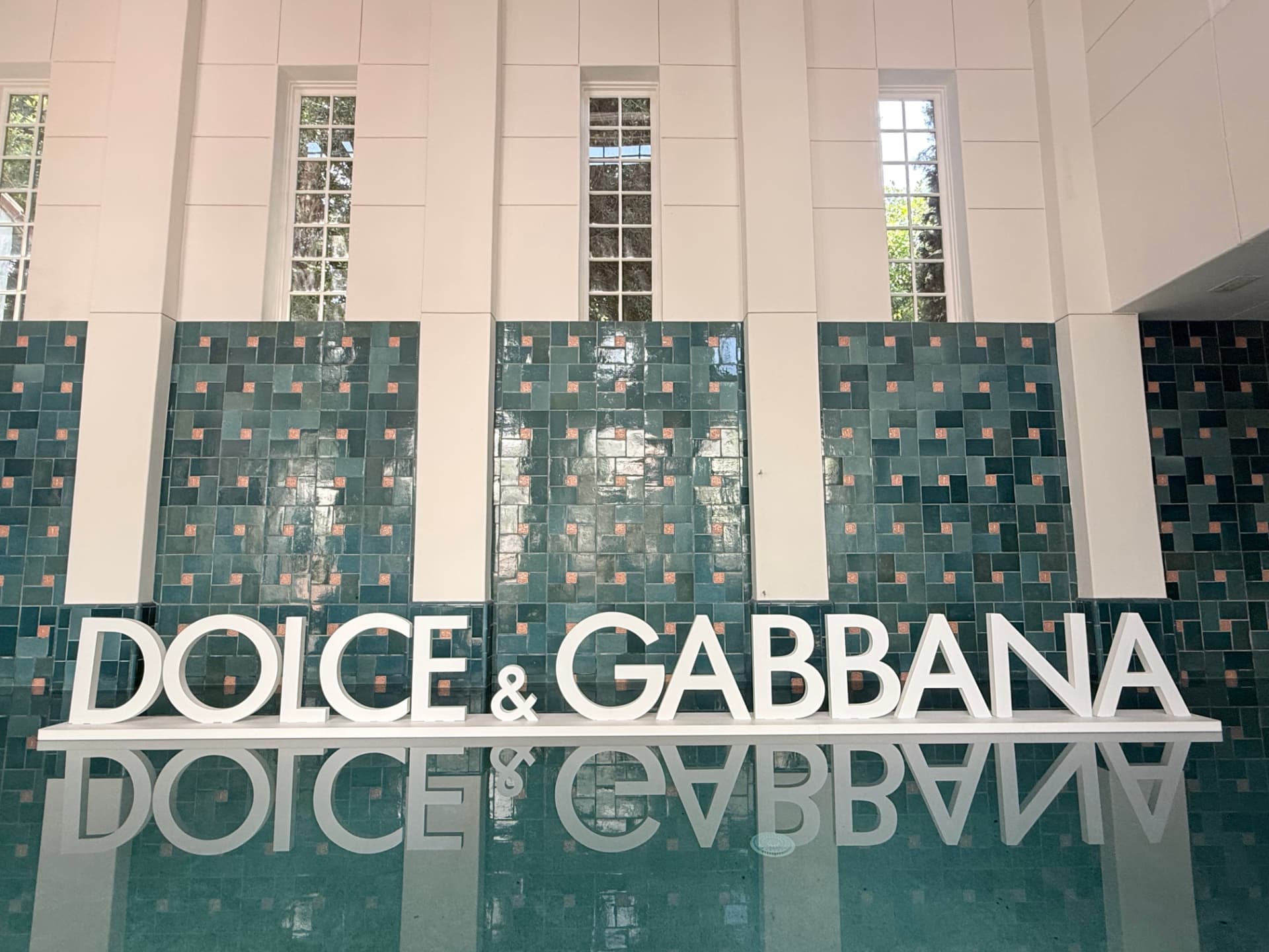 Dolce & Gabbana letters reflected in the indoor pool